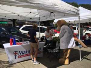 setup for the farmers market by the urgent care, MainStreet