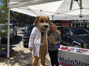 Woman and Mascot for MainStreet Family Urgent Care at downtown Eufaula farmers market