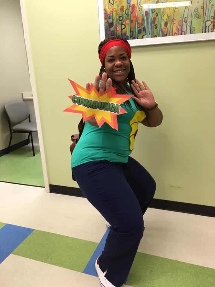 MA dresses like superhero for family appreciation week at MainStreet.