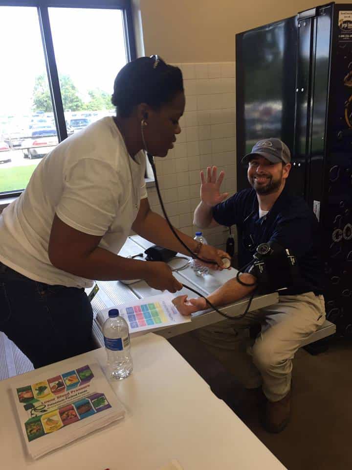 Brittany Thomas, CMA, MA checks man's blood pressure for Keystone from MainStreet Family Urgent Care