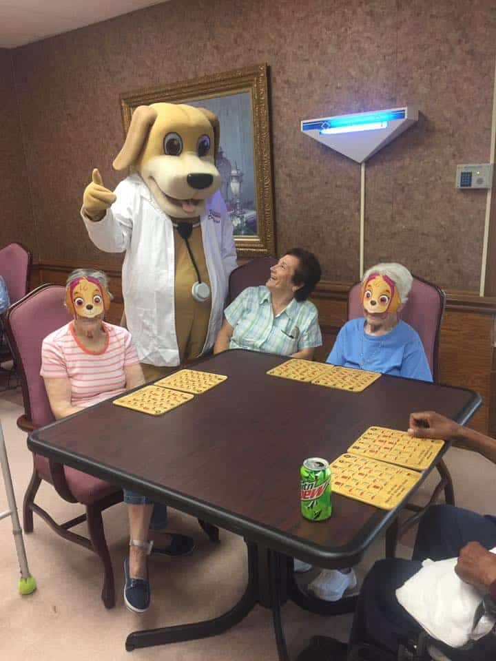 MainStreet Mascot meets elderly friends at Crowne Healthcare of Eufaula