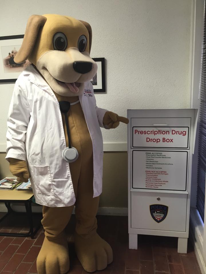 MainStreet Family Urgent Care Mascot stands by police drop box