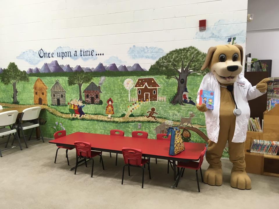 MainStreet Mascot poses at the library