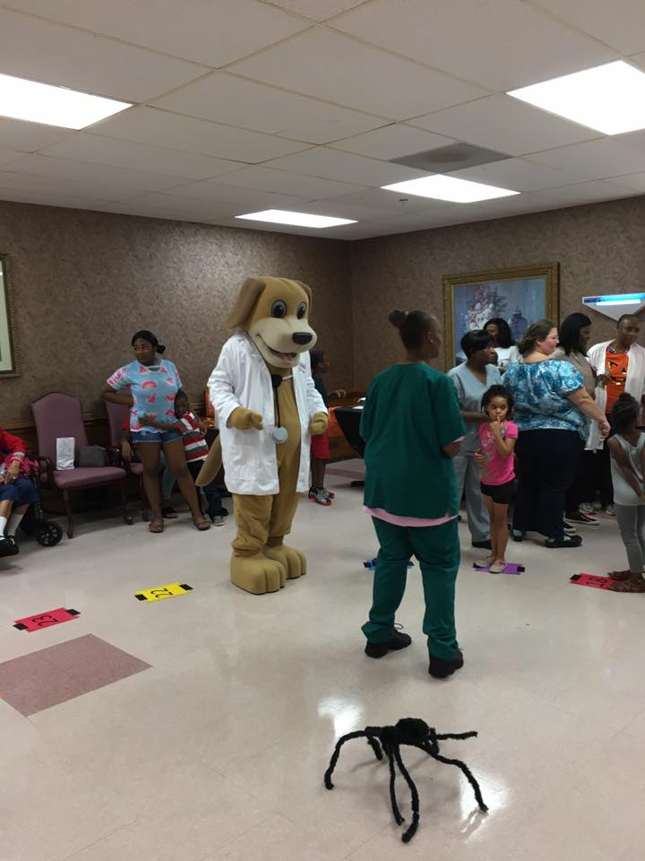 Mainstreet Mascot walks in the cake walk at crowne