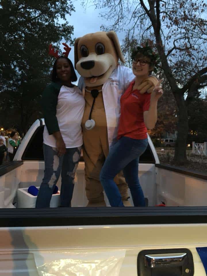 mainstreet mascot and clinic staff of urgent care in eufaula riding in parade 