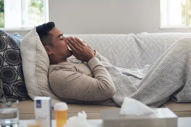 man on the couch with the cold or flu