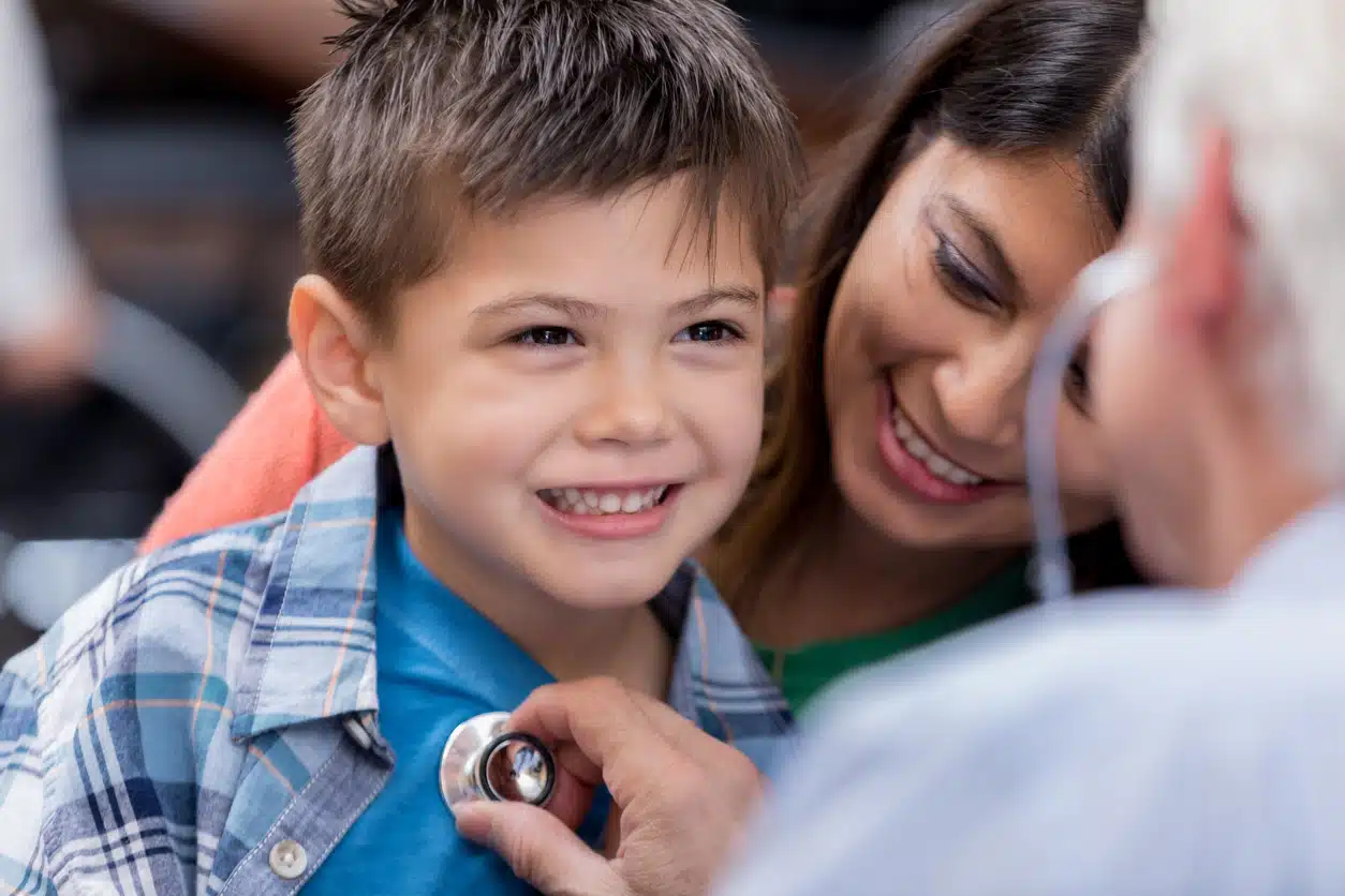 what services do urgent care clinics offer? Doctor examining a little boy