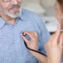 Nurse primary care providers checking heart