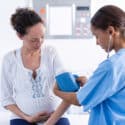 urgent care vs. primary care nurse checking bloodpressure