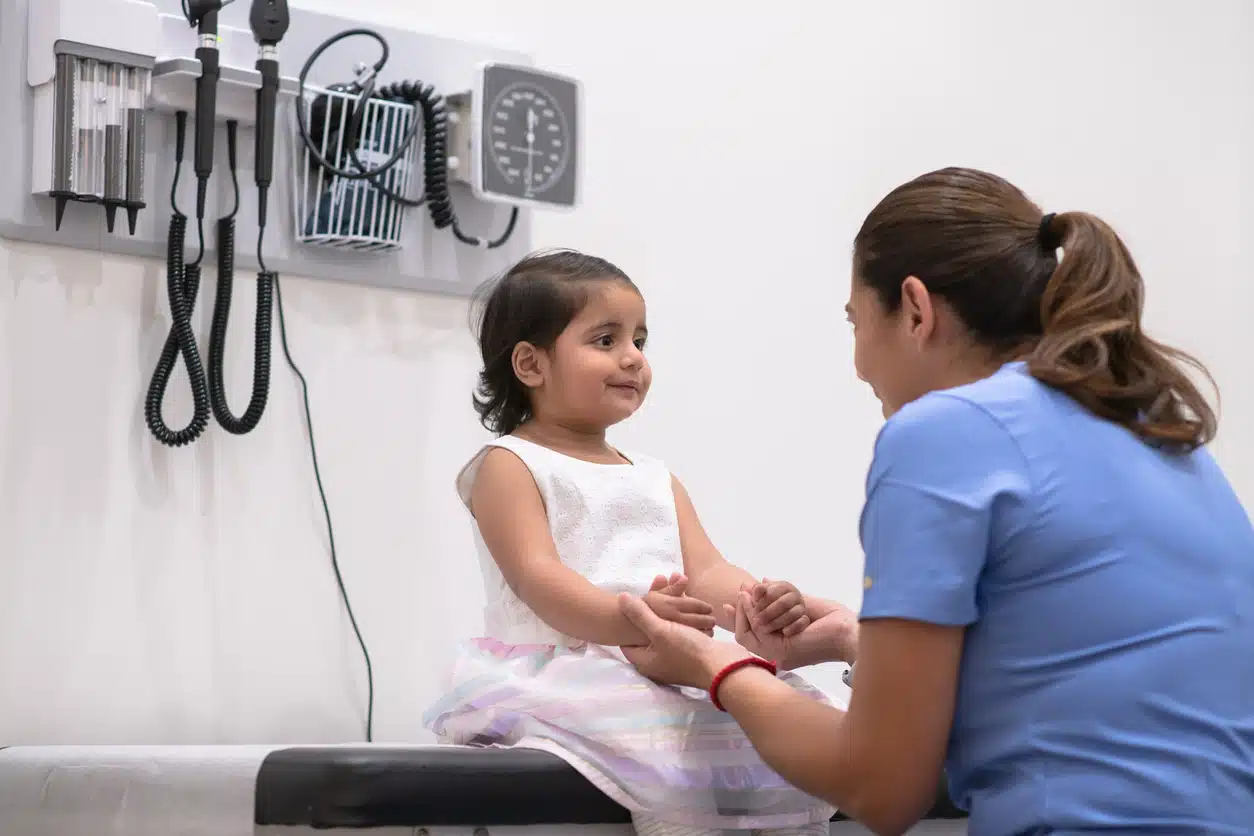 little girl at urgent care clinic with nurse