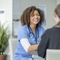 Female nurse giving pre-employment testing to another woman