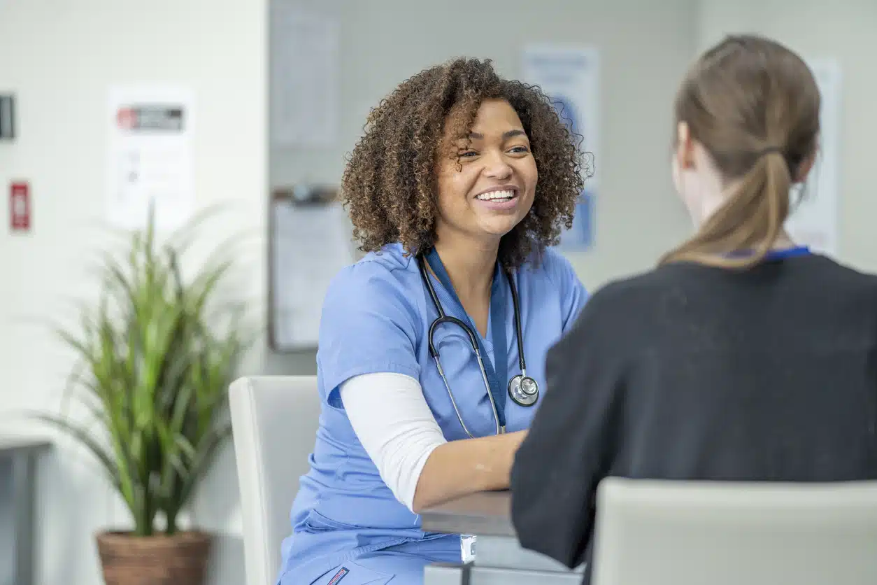 Female nurse giving pre-employment testing to another woman